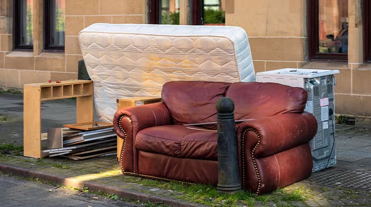 Old furniture being taken away for disposal